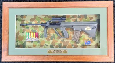 Framed 2000’s Australian Army ADF framed F88 Steyr rifle & medals